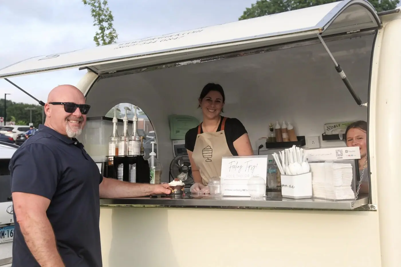 A local food-truck vendor serving a treat to a concertgoer at the Enfield Summer Concert Series
